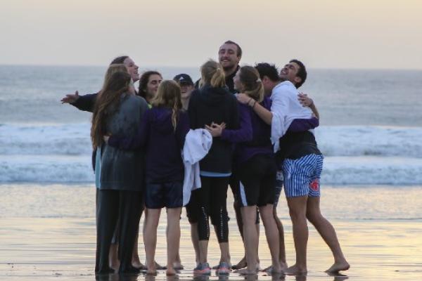 Student Athletes worshipping on the beach on a mission trip to Baja Mexico