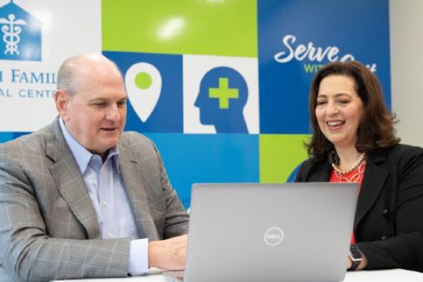 Phil Ellenburg and Sherry Mast working together in the clinic's employee break room