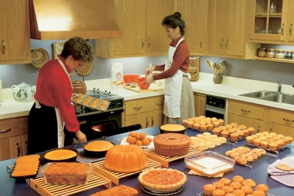 Linda Carman at right working in the Martha White test kitchen